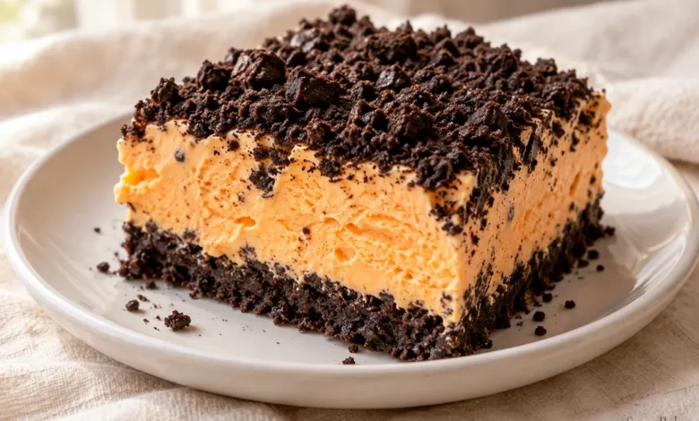 A frozen tray dessert layers a chocolate-cookie crust, orange sherbet and whipped cream.