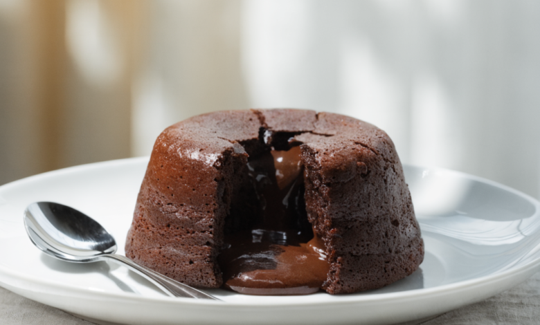 A delicious chocolate lava cake with a scoop of vanilla ice cream and a sprig of mint.