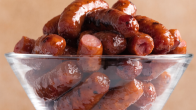 3-ingredient crockpot little smokies coated in barbecue sauce and grape jelly, served in a slow cooker with toothpicks.