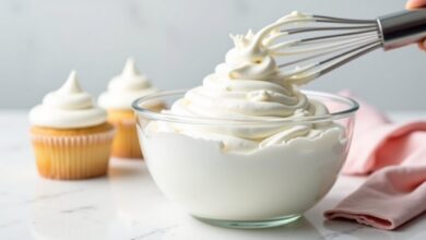 Fluffy glossy seven minute frosting lifted into a peak with a wire whisk